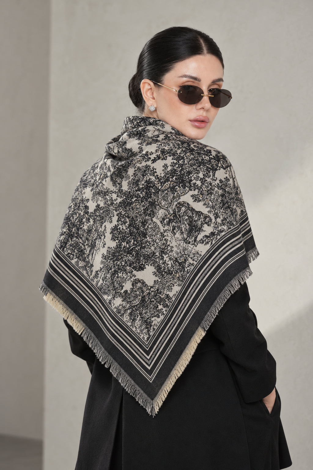 BLACK cashmere animal print square shawl folded into a triangle — triangle-back
