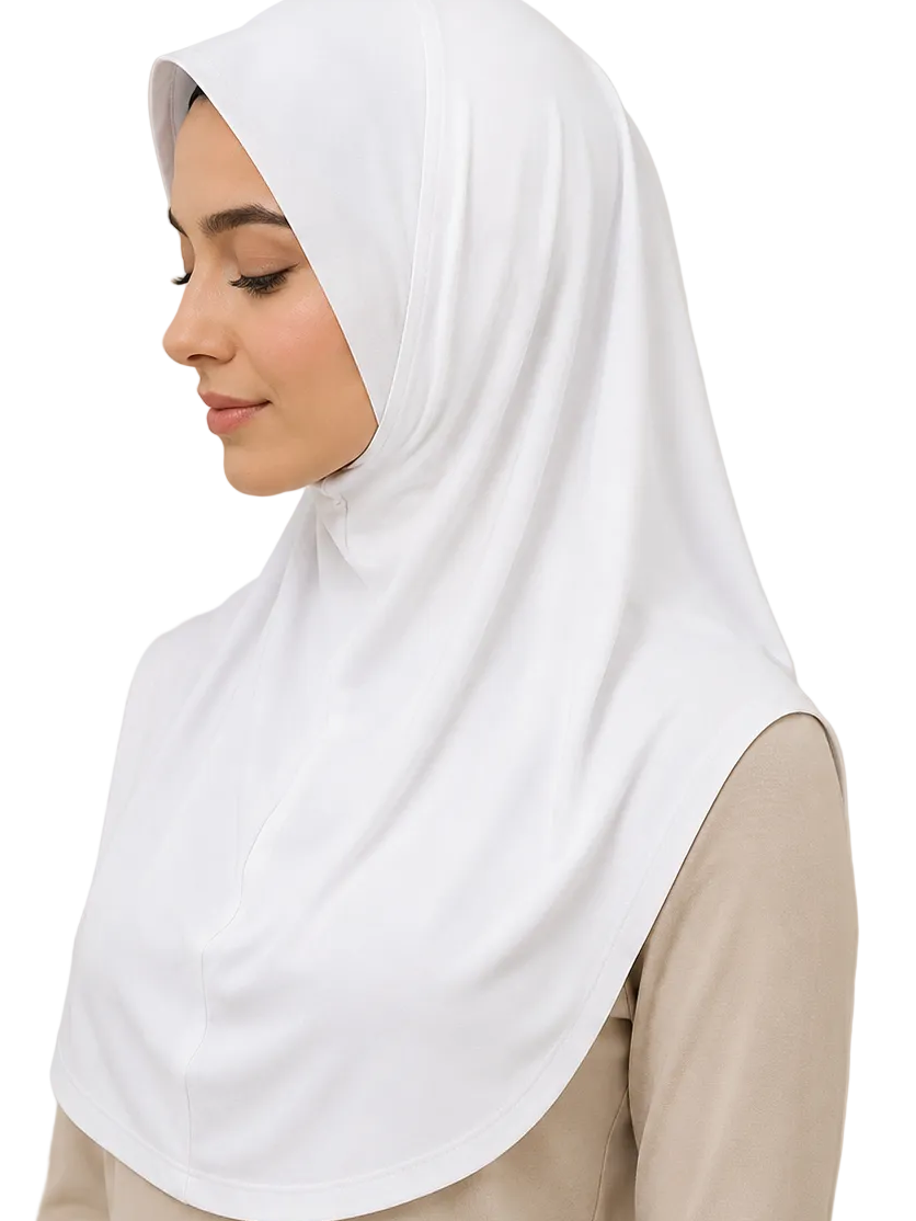 Woman wearing a white hijab against a beige background